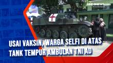 Usai Vaksin, Warga Selfi di Atas Tank Tempur Ambulan TNI AD