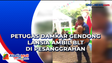 Petugas Damkar Gendong Lansia Ambil BLT di Pesanggrahan