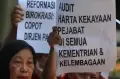 Aksi Menuntut KPK Tuntaskan Korupsi Pajak