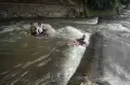 Serunya Bermain Air di Sungai Ciliwung