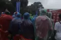 Basah Kuyub, Hujan Tak Menyurutkan Semangat Suporter Nonton Timnas Indonesia vs Argentina