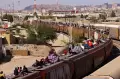 Nekat, Ribuan Migran Naiki Atap Kereta ke Perbatasan Meksiko-AS